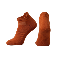 Pair of orange socks ankle whit no background