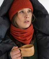 Viima alpacawool hat orange mätäs alpaca wool orange worn by a women drinking coffee